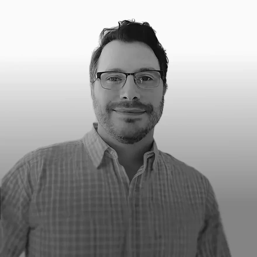 Black-and-white portrait of FTL CTO and Founding Engineer Ben Stiefel, a technology leader specializing in software development, building systems, automation, and scalable engineering solutions for commercial facilities.