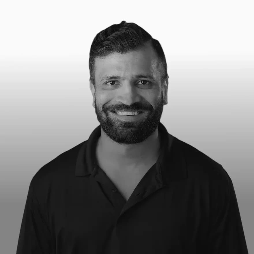 Black-and-white portrait of FTL Head of Operations Rush Shah, a building controls and operations expert specializing in commercial HVAC systems, automation, and scalable facility management solutions.